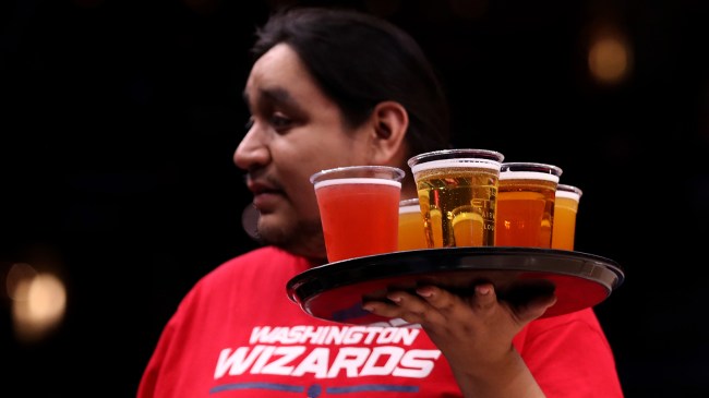 Man serving beer at NBA game