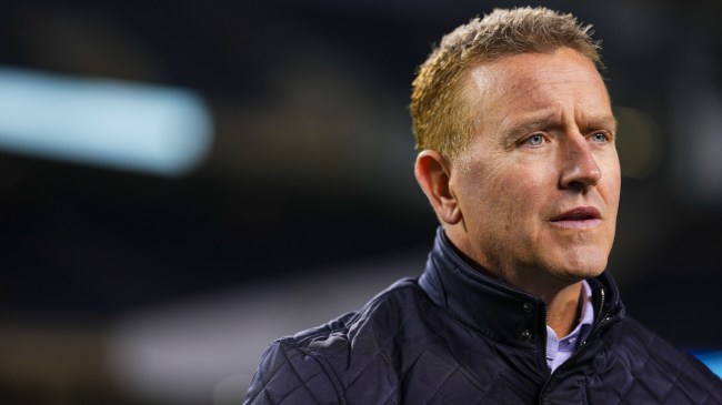 Kirk Herbstreit on the field before a game between the Bears and Panthers.