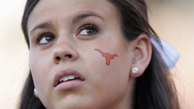 A Texas cheerleader watches on during a football game.