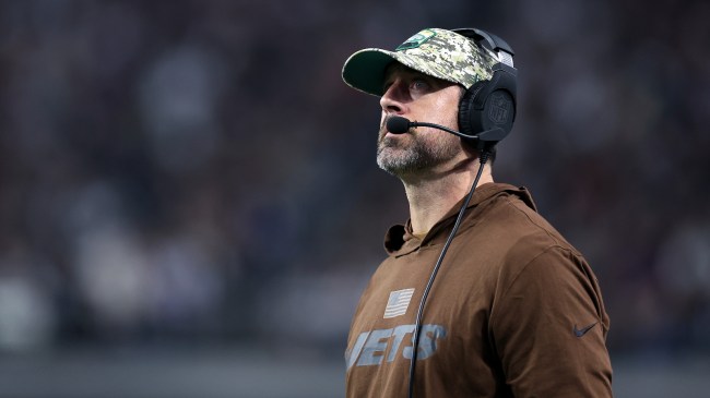 Aaron Rodgers on the sidelines during a game between the Jets and Raiders.