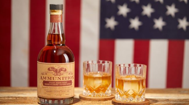Bottle of Ammunition Wine And Whiskey in front of an American Flag