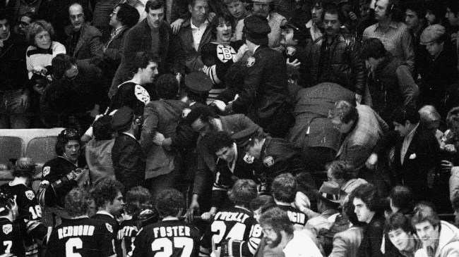 Bruins players fighting Rangers fans at NHL game in 1979