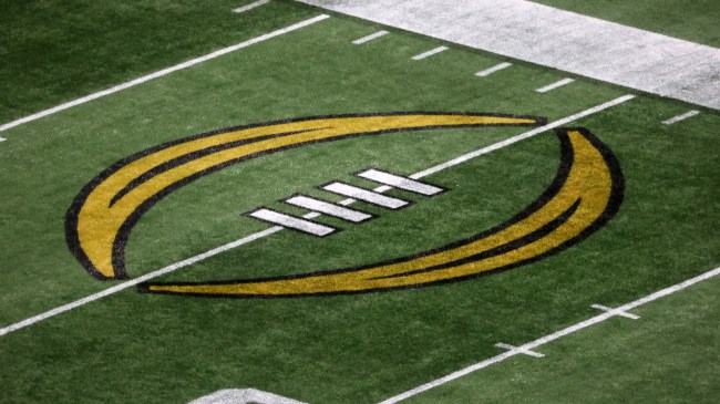 A College Football Playoff logo on the field.
