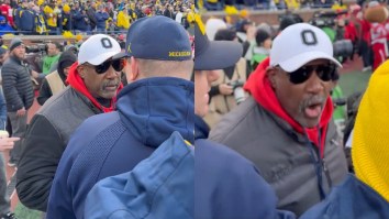 Michigan Staffer Slaps Camera Away From Heated Exchange With OSU Athletic Director Gene Smith