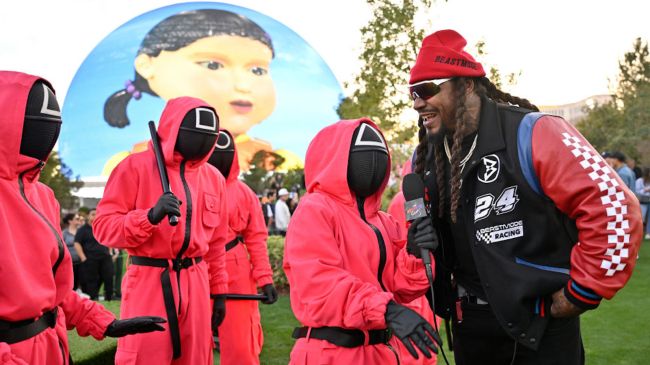 marshawn lynch on a las vegas golf course with squid game characters