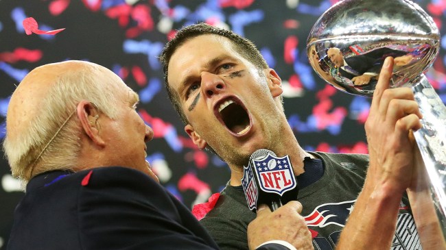 Patriots QB Tom Brady holding Super Bowl trophy