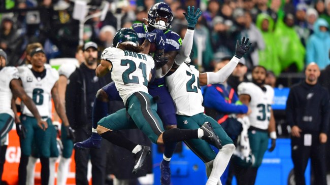Seahawks WR DK Metcalf makes a catch between a pair of Philadelphia Eagles defenders.