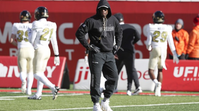 Deion Sanders walks the field before a game between Colorado and Utah.