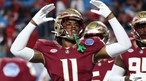 A Florida State player reacts to a play on the field.
