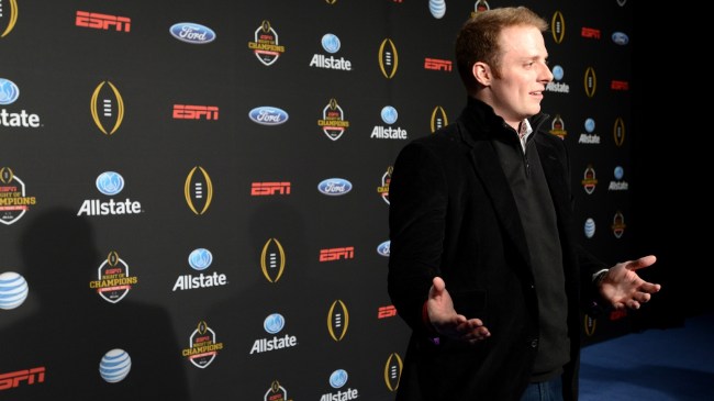 Greg McElroy poses for a photo at a College Football Playoff event.