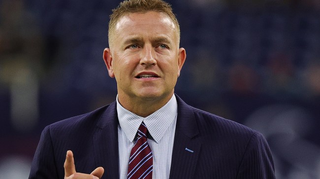 Kirk Herbstreit on the field before a football game.