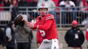 Quarterback Kyle McCord of the Ohio State Buckeyes looks for a open receiver