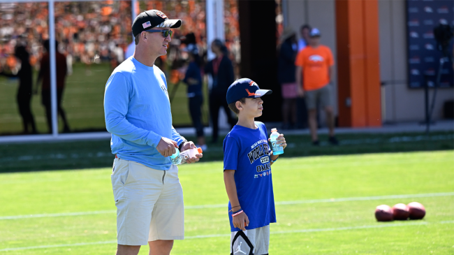 Peyton Manning and his son Marshall at Broncos training camp