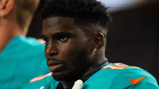 Tyreek Hill 10 of the Miami Dolphins looks on from sideline