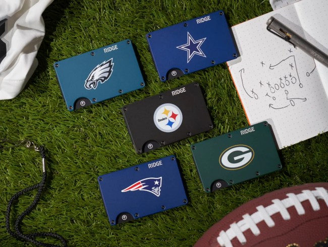 Ridge Wallet NFL Team wallets for the Philadelphia Eagles, Dallas Cowboys, New England Patriots, Pittsburgh Steelers, and Green Bay Packers shown with a football