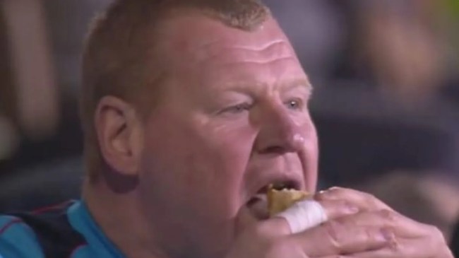 Wayne Shaw eating a meat pie