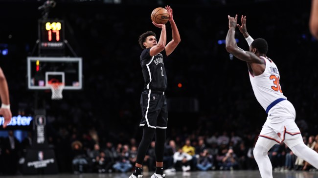 Brooklyn's Cameron Johnson shoots a three-point shot vs. the Knicks.