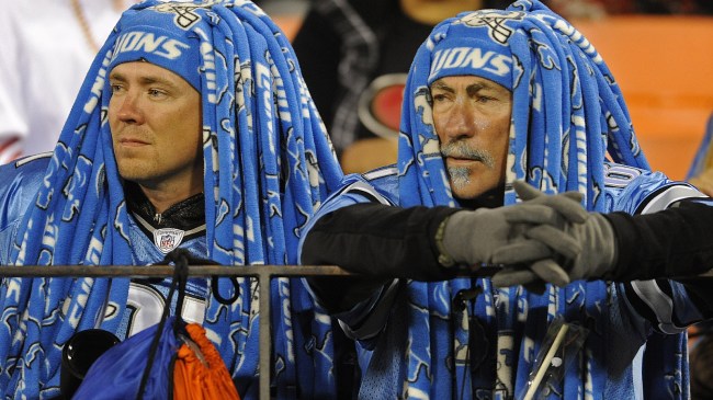 Detroit Lions fans watch a game from the stands.