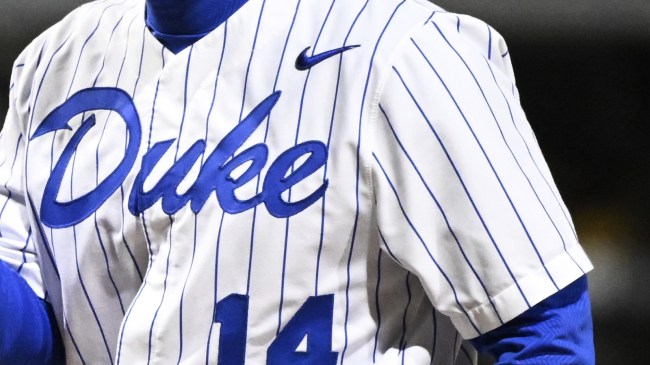 A Duke logo on the jersey of the head baseball coach.