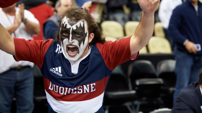 A Duquesne basketball fan celebrates during a game against Pitt.