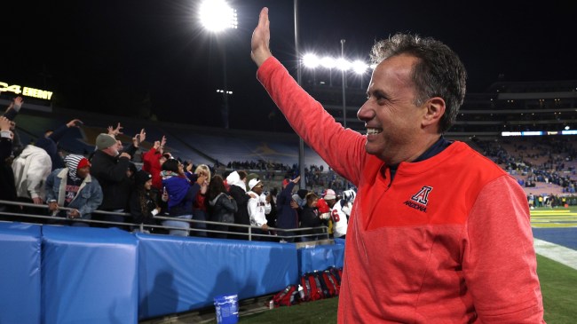 Jedd Fisch waves goodbye to Arizona fans after a win.