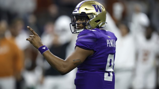 Michael Penix reacts to a play during a College Football Playoff matchup between Washington and Texas.