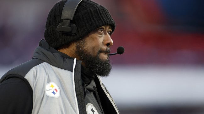 Mike Tomlin coaches from the sidelines during a playoff game between the Steelers and Bills.