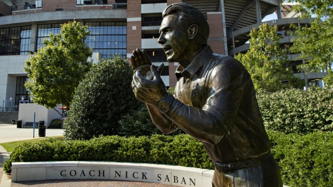 A statue of Nick Saban outside Bryant-Denny Stadium.
