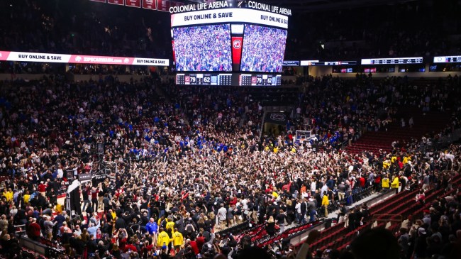 Fans rush the court after South Carolina upsets sixth-ranked Kentucky.