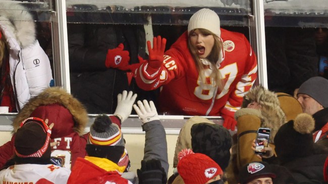 Taylor Swift celebrates with fans during AFC Wild Card Game