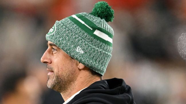 aaron rodgers in a green jets beanie