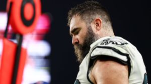 jason kelce lookiing down on the sidelines during his final nfl game