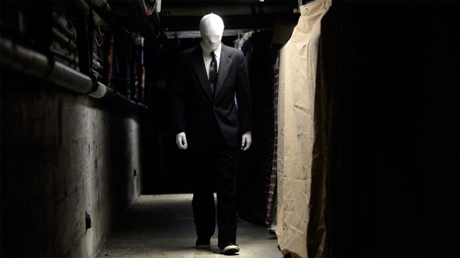 person dressed up in slender man costume