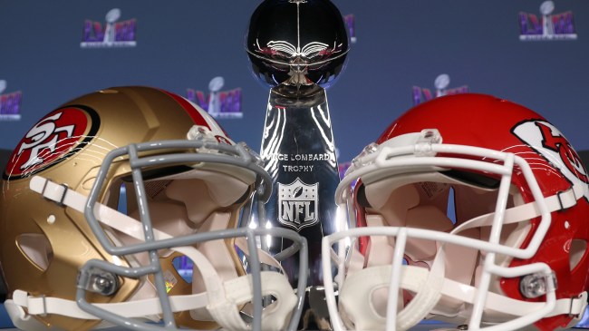 49ers and Chiefs helmets in front of Super Bowl trophy