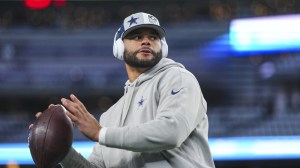 Dak Prescott warms up before a playoff game between the Packers and Cowboys.