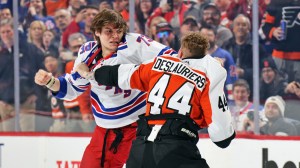 Philadelphia Flyers player Nic Deslauriers fights Matt Rempe of the New York Rangers in an NHL Hockey game