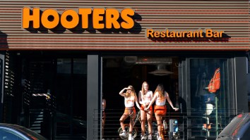Hundreds Turn Out For Candlelight Vigil At Hooters Before Its Demolition