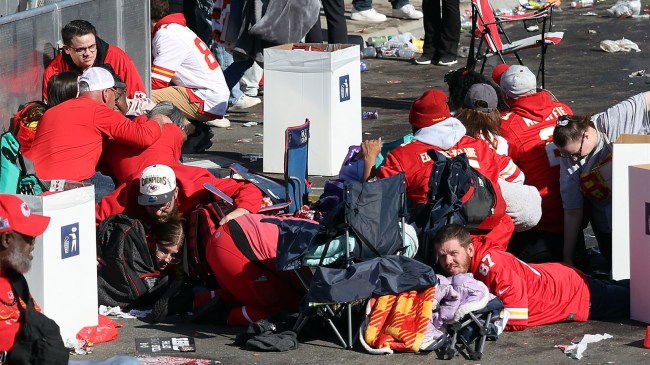People take cover during a shooting at Chiefs Super Bowl parade