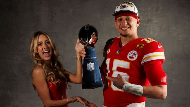 patrick mahomes and brittany mahomes holding the super bowl trophy