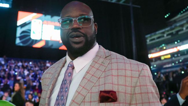 shaq wearing glasses and a plaid suit