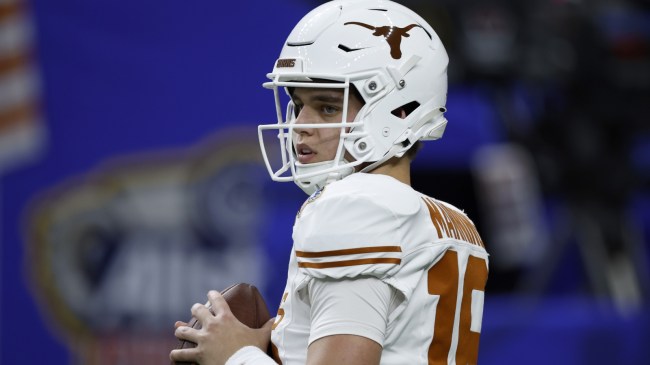 Texas QB Arch Manning warms up before a CFP matchup against Washington.