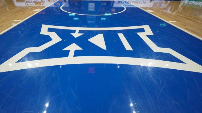 A Big XII logo on the basketball floor.