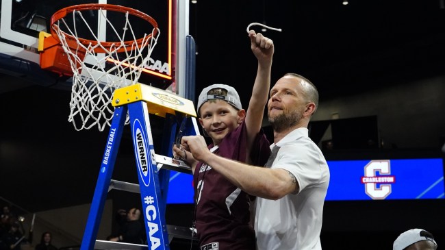 College of Charleston coach Pat Kelsey cuts down a net with son, Johnny.