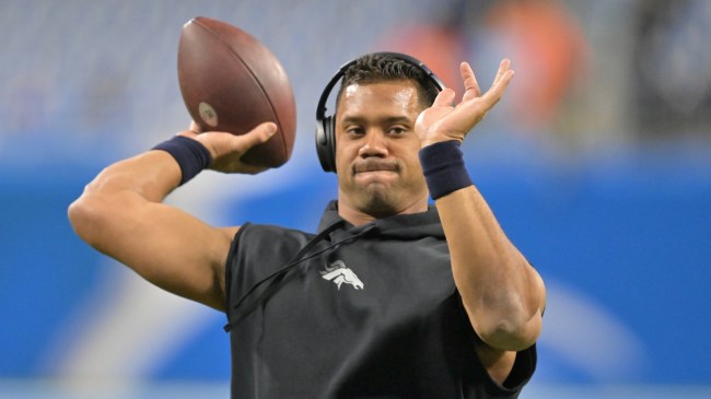Russell Wilson warms up before a Denver Broncos game.