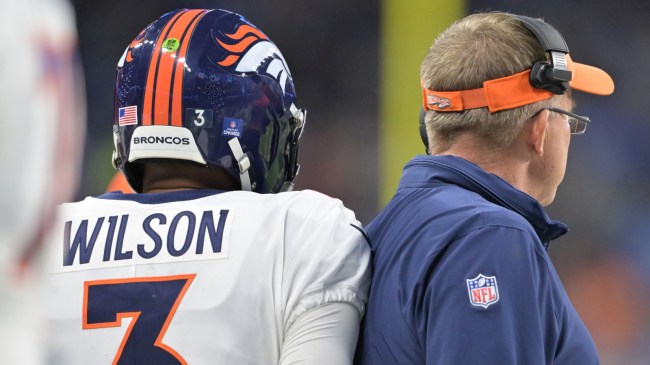 Broncos QB Russell Wilson brushes up against head coach Sean Payton.