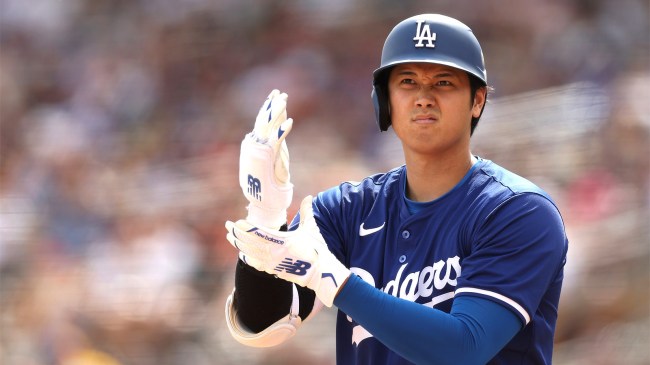 Shohei Ohtani of the Los Angeles Dodgers warms up on deck