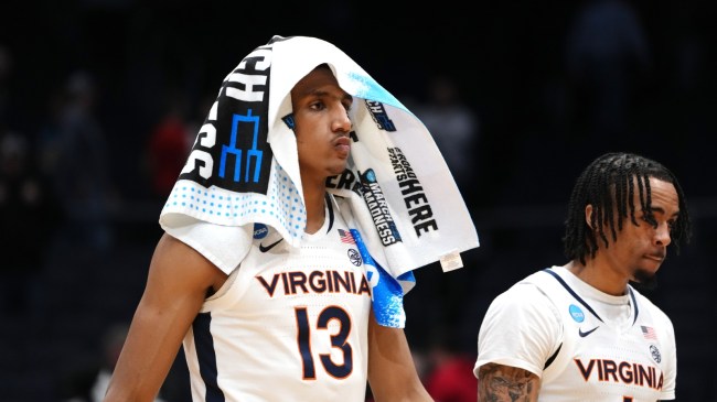 Virginia players walk off the court after an NCAA Tournament loss.