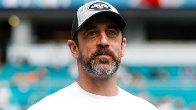 aaron rodgers wearing a jets hat