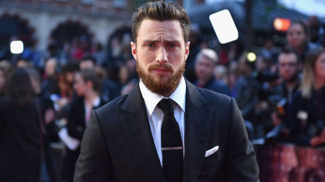 aaron taylor johnson wearing a suit