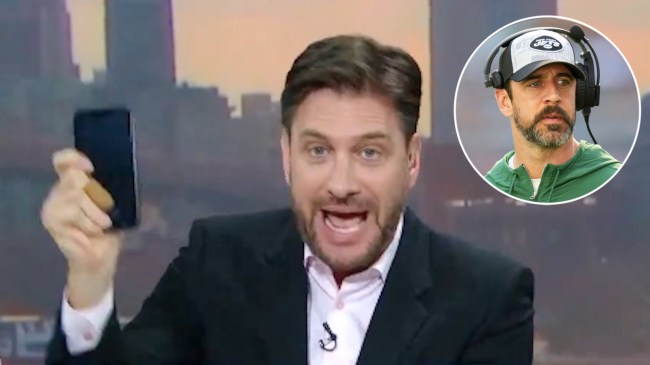 mike greenberg yelling and holding an iphone on espn